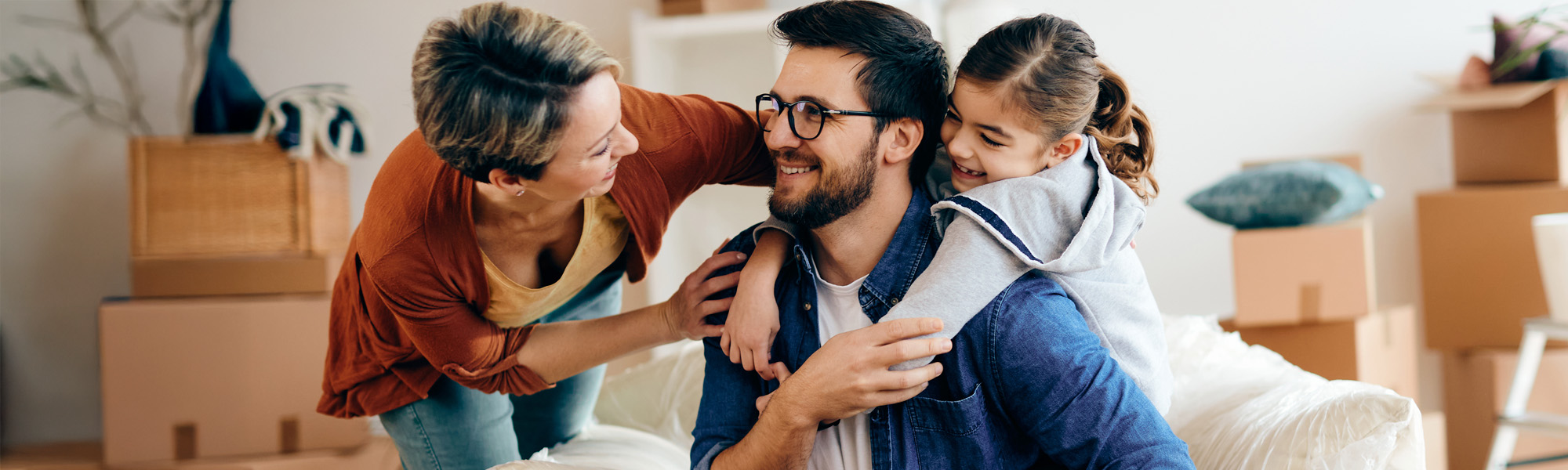 Happy family talking and having fun while relocating into a new home
