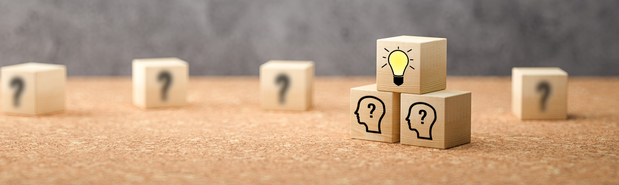 cubes showing a brainstorming session on concrete background