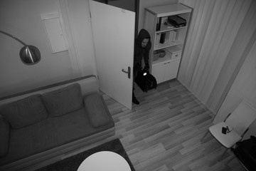 man committing burglary from video camera