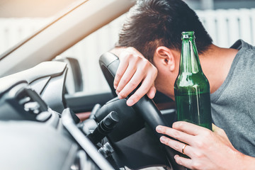 boy with beer in car