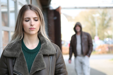 man stalking girl