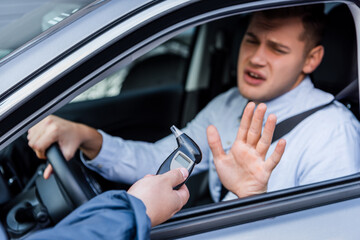 man with breathalyzer